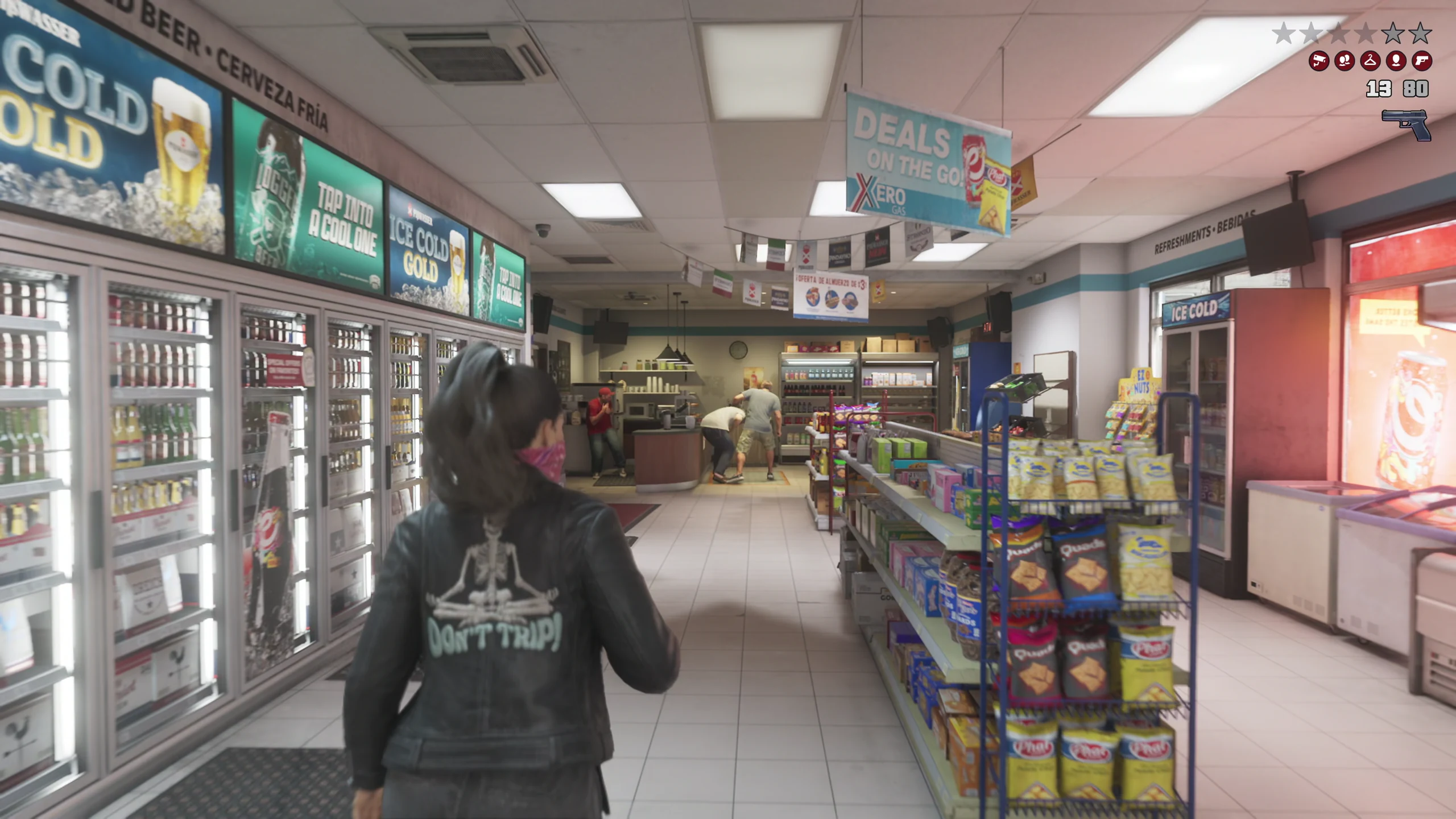 A masked figure walking down the aisle of a lit convenience store toward the counter, where two people are crouched and standing with hands raised, the wanted stars and heat indicators showing in the corner
