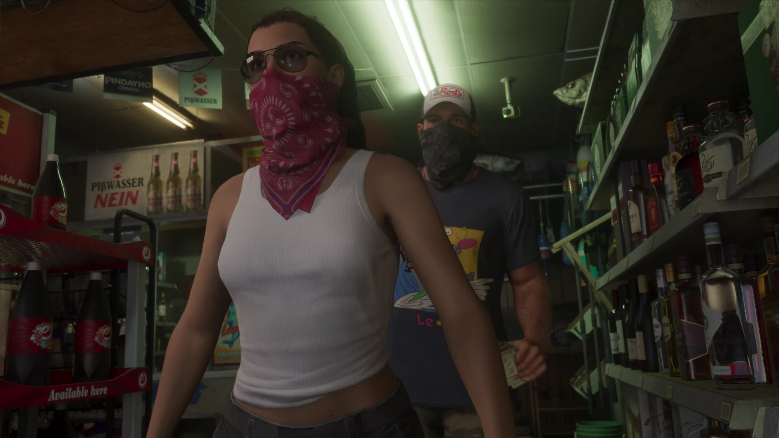 The two leads masked with bandanas inside a corner shop, one moving toward the door while the other follows with a handful of notes