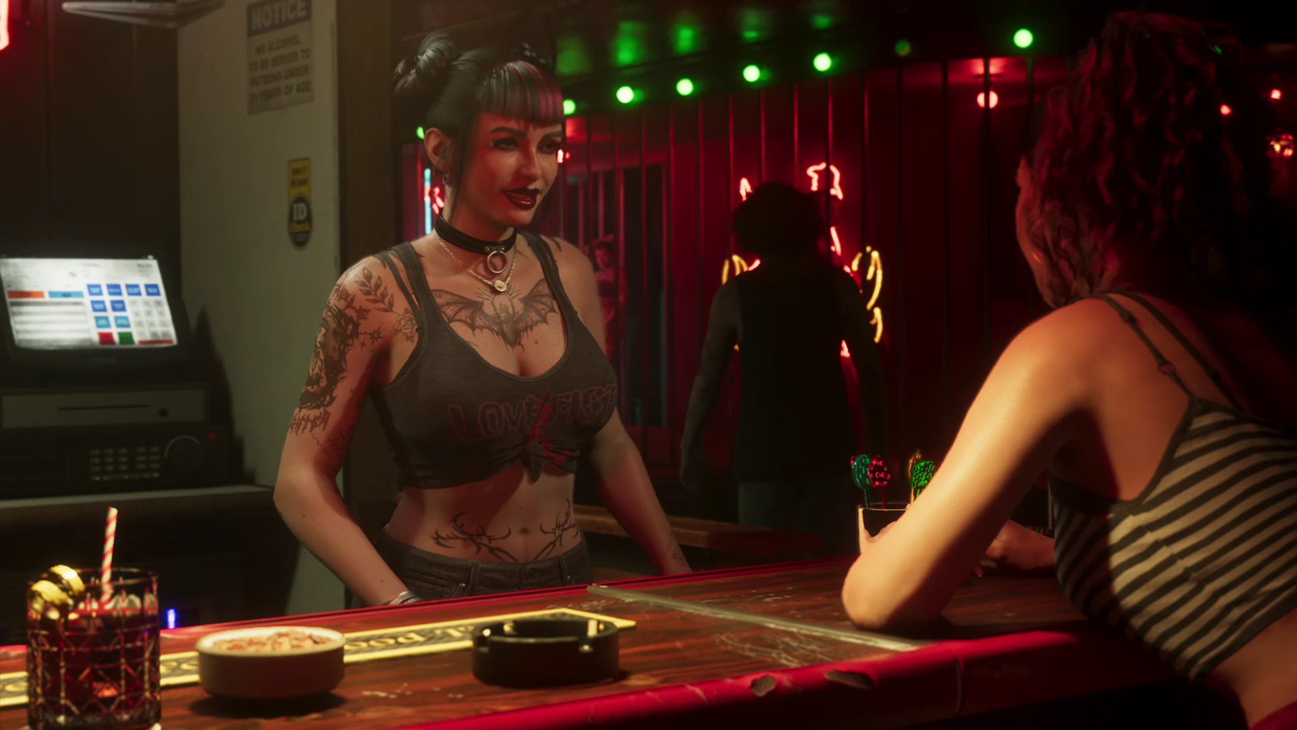 A tattooed bartender talking to a customer across the bar of a neon-lit venue, with another figure moving in the background